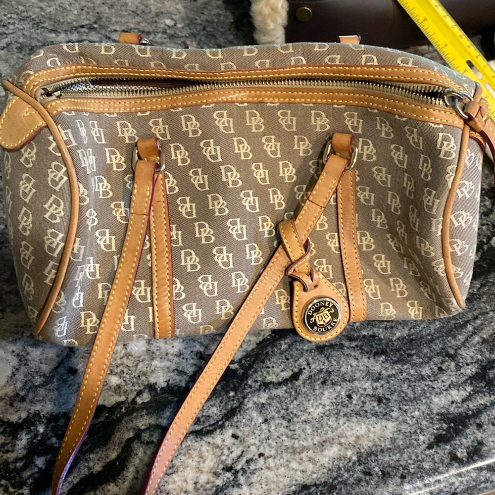 Dooney&Bourke khaki tan in color
